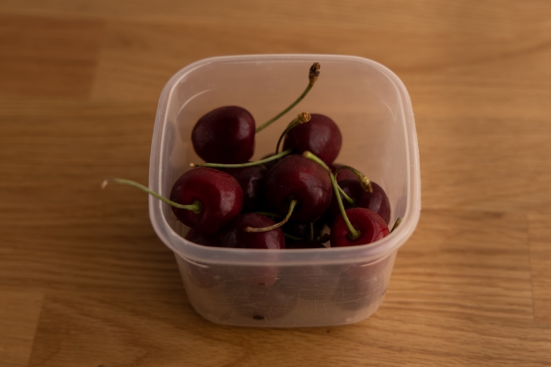 Cherries in a half-open container