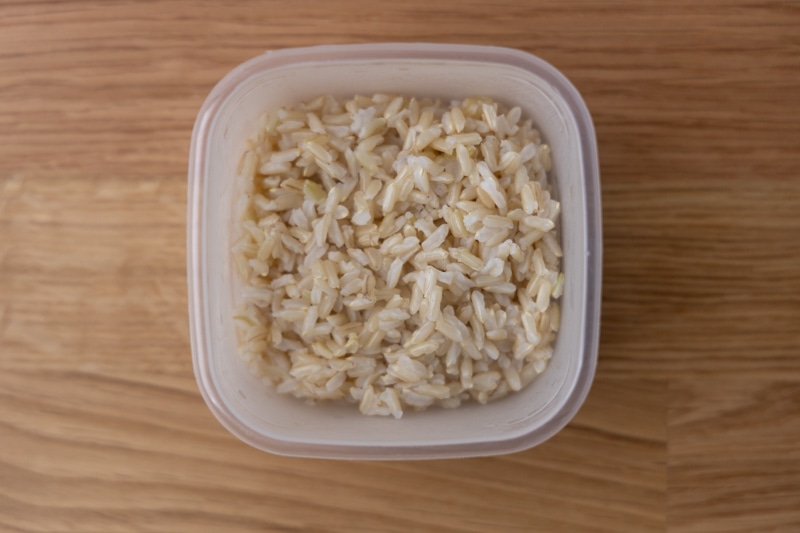 Cooked brown rice in a container