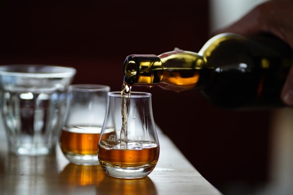 Pouring whiskey into glass